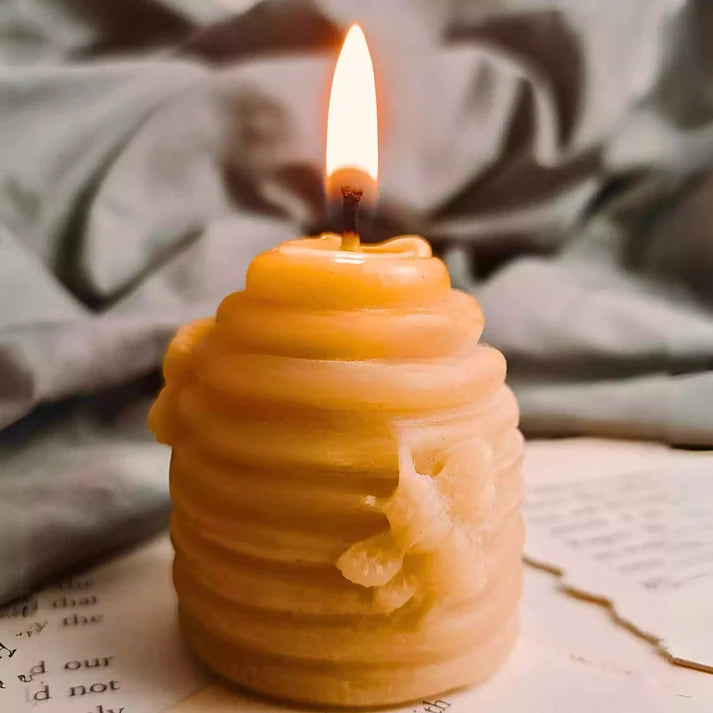 Hand-poured pure beeswax beehive shaped candles manufactured in our Leicester workshop for UK wholesale.