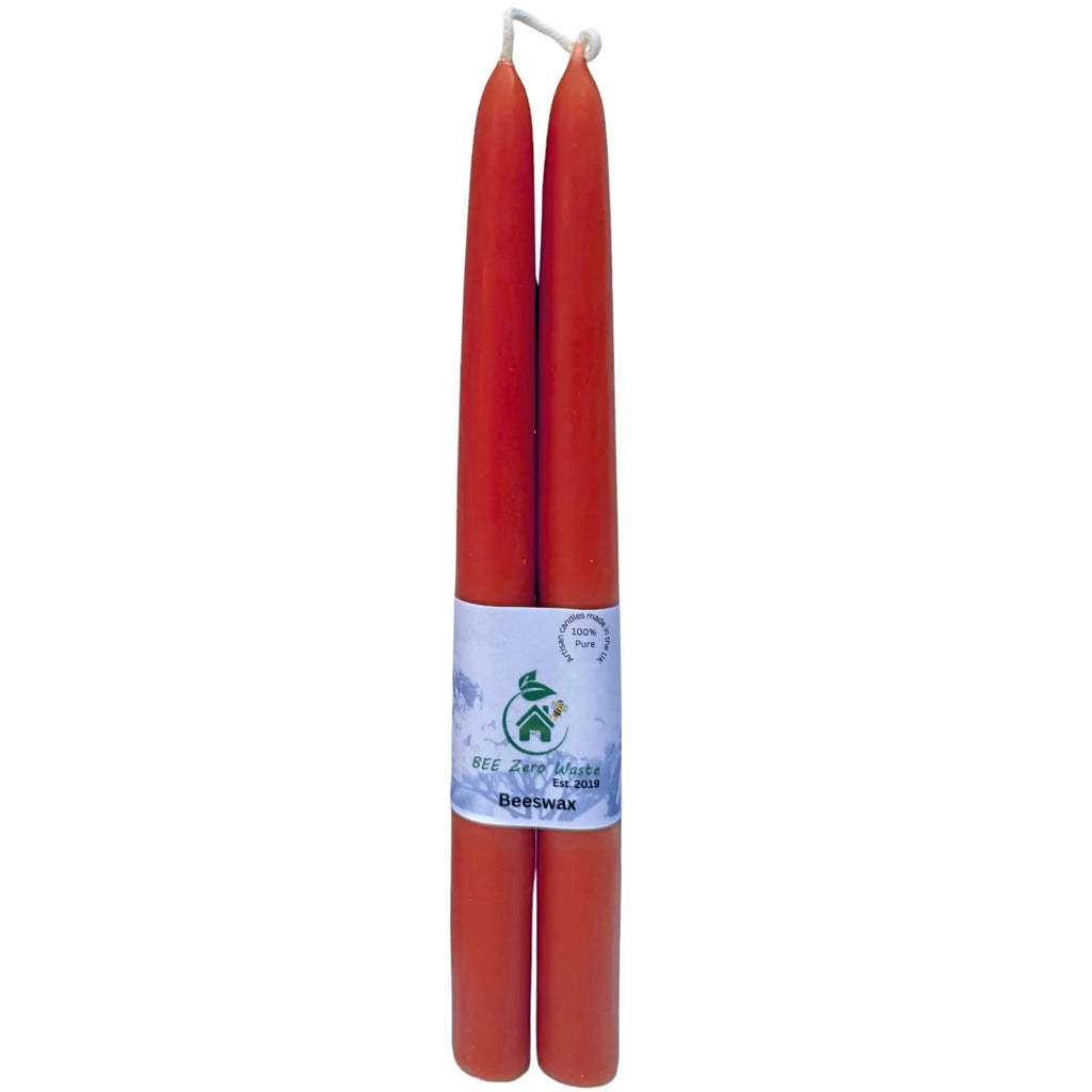A bulk bundle of natural beeswax taper candles tied with twine, ready for wholesale and private label orders.