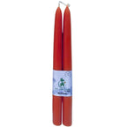 A bulk bundle of natural beeswax taper candles tied with twine, ready for wholesale and private label orders.