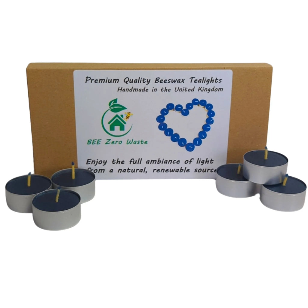 Open bulk box showing unlabelled 100% natural beeswax tealight inserts for shop refill stations.