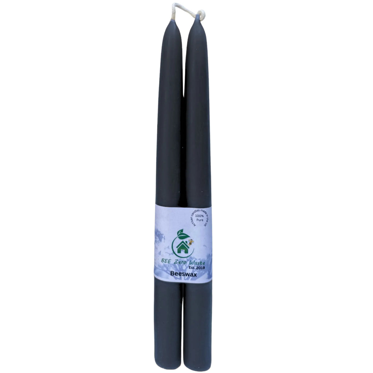 Tall black beeswax taper candles used as natural, eco-friendly centrepieces for a wedding reception table.