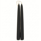 A set of smooth taper candles showcasing the rich, natural black colour of unrefined beeswax.