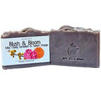 Hand-poured natural clay and botanical powder soap offering plastic-free skincare.