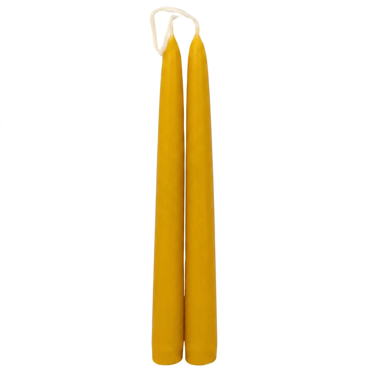 Close-up of the textured surface on hand-dripped beeswax taper candles showing their natural golden honey colour.