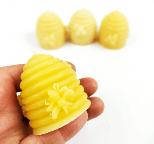 Bulk trade supply of natural yellow beeswax skep votives for independent boutiques and farm shops.